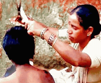 yadamma, woman barber in Nalgonda, Andhra Pradesh. She's  successfully stormed a male bastion in conservative India
